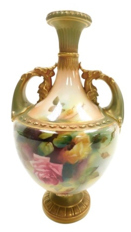 A Royal Worcester blush porcelain vase, circa 1907, of twin handled baluster form, painted by R. Austin with roses, gilt heightened, pattern number 1683, printed marks, 25cm high.