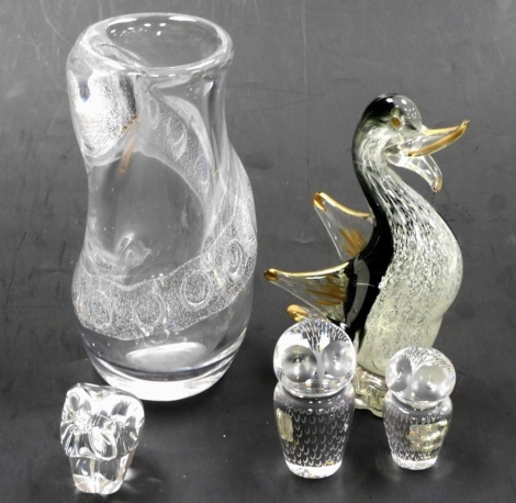 A Scandinavian style abstract glass vase, unsigned, 23cm high, together with two Kosta glass owl paperweights, 9cm high and 7cm high respectively, a Langham glass model of an elephant, and a further glass model of a bird.