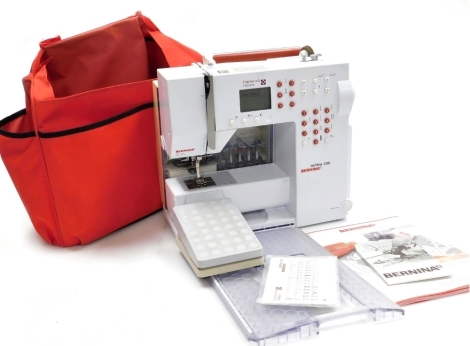 A Bernina Activa 230 patchwork additions sewing machine, with outer canvas case, foot pedal, etc.