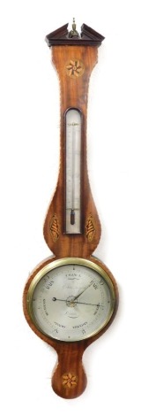 A 19thC mahogany and inlaid Sheraton revival banjo barometer, the silvered dial for G. Silver Stamford and Lincoln, with thermometer, the case inlaid with shells and floral rosettes, 88cm high.