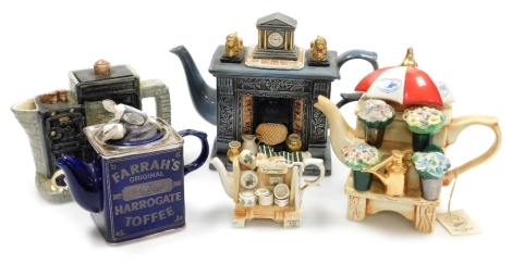 A group of novelty pottery teapots, comprising a Cardew Design Classical Fireplace teapot, limited edition 247/5000, a Border Fine Arts James Herriot's Country Kitchen, 470953, a miniature Portmeirion teapot, a Farrahs Original Harrogate Toffee teapot, an