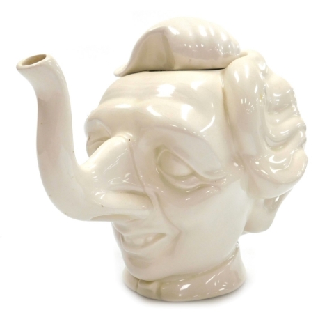 A Fluck & Law novelty pottery teapot, for Carllton ware, in the form of a caricature of Margaret Thatcher, 21cm high.