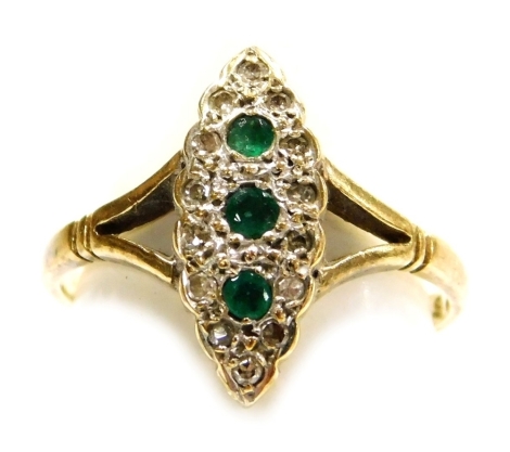 An Art Deco style 9ct gold emerald and diamond ring, in a lozenge shaped setting, size J, with receipt of purchase 1990, 2.0g.