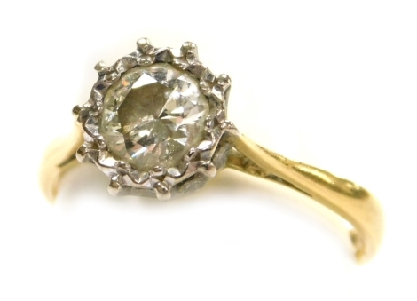 A diamond solitaire ring, in a high claw illusion setting, set in yellow metal, diamond approximately 0.7ct, size K, 2.9g.