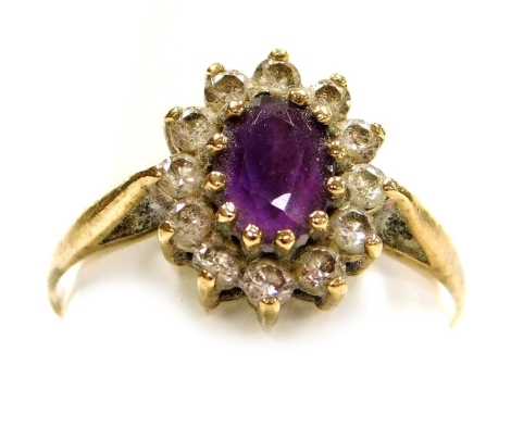 A 9ct gold amethyst and cubic zirconia ring, in an oval claw mount, size O, 1.6g.