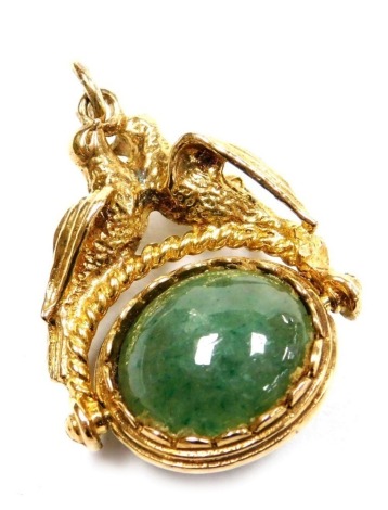 A 9ct gold and hardstone set pendant swivel fob, the oval frame surmounted by a pair of doves, 9.9g.