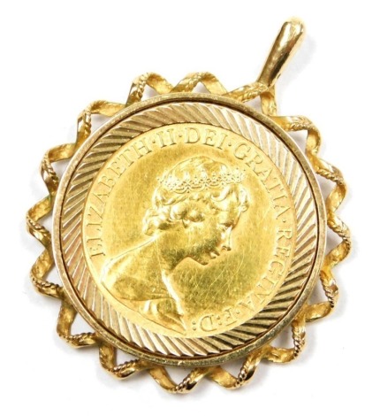 A Queen Elizabeth II gold full sovereign 1974, in a 9ct gold pendant mount, with receipts of purchase, dated 1990, 11.4g.