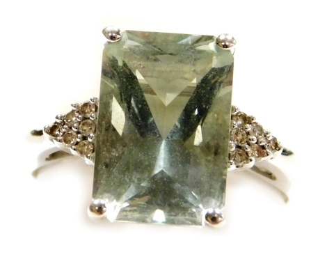 A 9ct white gold and green quartz solitaire ring, in a high claw setting, the shoulders each set with diamonds, size N, 3.7g all in.