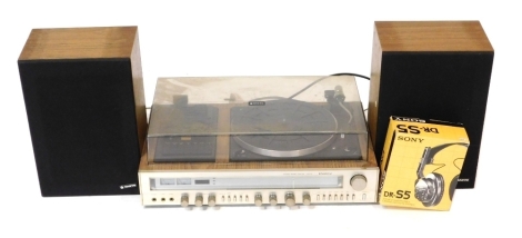 A Sanyo stereo music centre, G3002, 61cm wide, together with a pair of Sanyo speakers, and a pair of Sony DR-S5 headphones. Buyer Note: WARNING! This lot contains untested or unsafe electrical items. It is supplied for scrap or reconditioning only. TRADE 