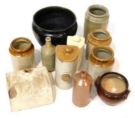 A group of stoneware, to include two foot warmers, bottle for West & Co Grantham, Thomas Taylor Surgeon Derby, etc. (1 box and loose)