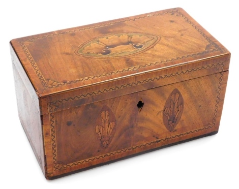 A George III mahogany inlaid and cross banded tea caddy, the top decorated with a shell paterae, the sides with Prince of Wales feathers, acorns and stars, the hinged lid enclosing a vacant interior, 27cm wide. (AF)