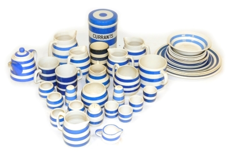 A group of blue and white banded Cornish ware pottery, to include dinner plates, miniature teapot, milk jug, salt and pepper shakers, egg cups, etc. (a quantity) Auctioneer announce: only Currants jar and cover is Cornishware, the remainder is Staffordsh