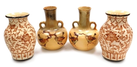 A pair of early 20th pottery two handled vases, of globular form with an elongated neck, each hand painted with birds against a mottled cream ground, 24cm high, together with a further pair of pottery baluster vases, with incised floral and leaf decoratio