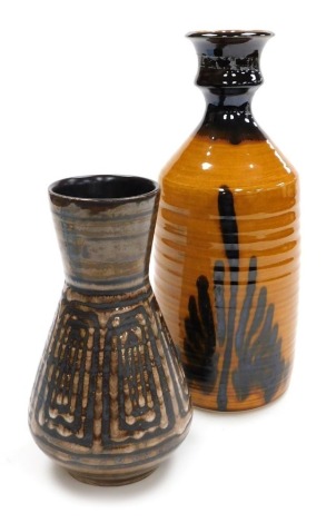 A Bob Culloden pottery vase, of cylindrical form with a shaped neck, decorated with abstract line decoration against a mustard yellow ground, impressed marks, 35cm high, together with a Cinque Pottery vase with lustre decoration against a brown ground, pr