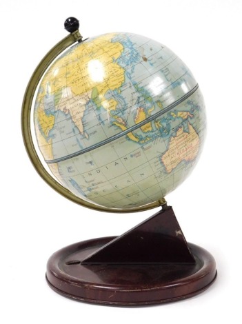 A mid century Chad Valley tin terrestrial globe, on a circular base, 28cm high.