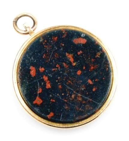 A bloodstone fronted hair locket pendant, set in yellow metal, with a loop suspension, 6.4g.