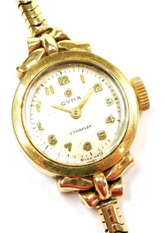 A Cyma 9ct gold cased lady's wristwatch, circular silver dial bearing Arabic numerals, on a 9ct gold strap, 14.6g.