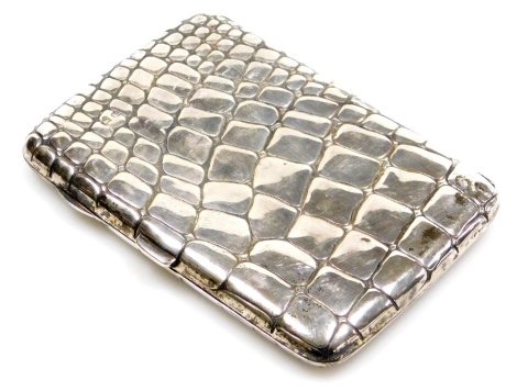 An early 20thC silver cigarette case, of simulated crocodile skin form, hallmarks rubbed, 2.01oz, 11cm high.