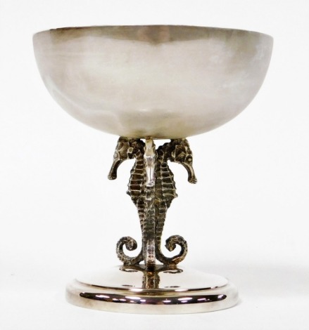 An Elizabeth II silver cup, the bowl of circular form, raised on three conjoined seahorse shaped supports and a circular base, maker SC, Sheffield 1976, 6.53oz, 11cm high.