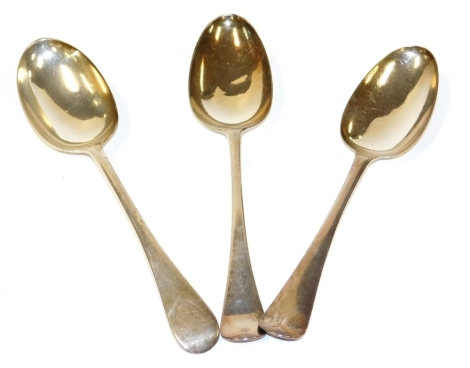 A George II silver rat-tail pattern serving spoon, London 1756, together with a further early Georgian rat-tail pattern spoon, each bearing initials to the reverse of the handle, together with a George II Old English pattern serving spoon, London 1734, 6.