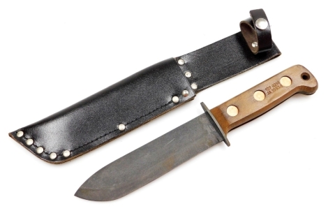 A British Army survival knife 1993, serial number 127 8214, JA 1993/1, with sheath, 33cm wide.