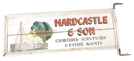 A Hardcastle & Son Chartered Surveyors and Estate Agents painted wooden sign, mounted on two metal wall brackets, 110cm wide.