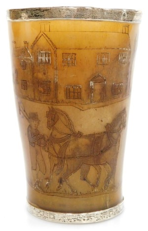 An early 19thC horn beaker, engraved with agricultural and dancing figures, houses, a barn, and cattle, with white metal mounts, 10cm high.