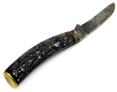 An early 20thC folding hunting knife, with steel blade, indistinctly signed, and Delrin handle, 10cm wide.