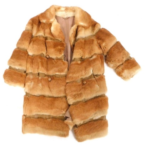 A 1960s fox fur three quarter length coat, with wooden rounded buttons, underarm measurement approximately 46cm.