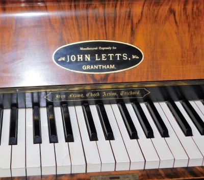 A Victorian walnut and inlaid upright piano, for John Letts of Grantham, with an iron frame, check action and trichord, serial number 1078/546. - 2