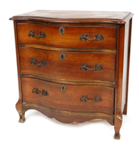 A 20thC French serpentine mahogany chest, of three long drawers, raised on cabriole legs, 74cm high, 72cm wide, 38cm deep.