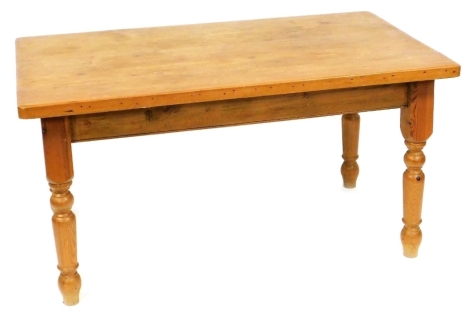 A pine kitchen table, raised on turned legs, 79cm high, 153cm wide, 92cm deep.