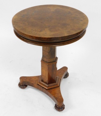 A Victorian walnut rise and fall dumbwaiter, with three circular tiers, raised on a hexagonal column, over a triform base on carved bun feet, 112cm high, 56cm wide. - 2