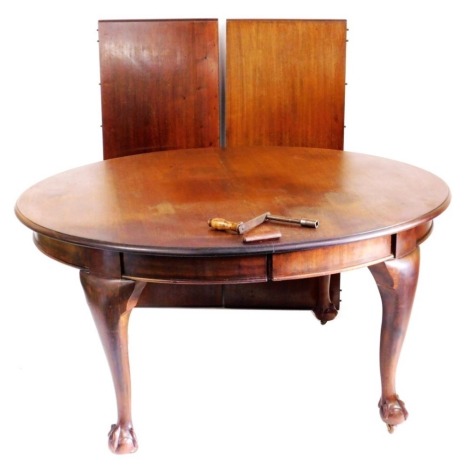 A Victorian mahogany extending dining table, the oval moulded top raised on four ball and claw feet, with two leaves, 74cm high, 146cm wide, 156cm extended, 117cm deep.