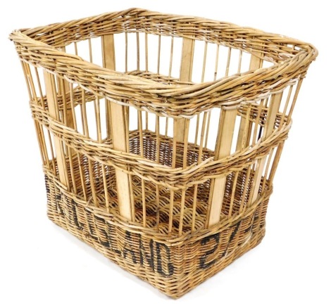 A large wicker basket, of rectangular tapering form, marked Martins 214, 70cm high, 86cm wide, 69cm deep.