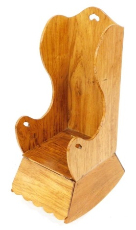 An oak child's commode chair, in 18thC rustic style, with hinged seat lid, etc., 30cm wide.