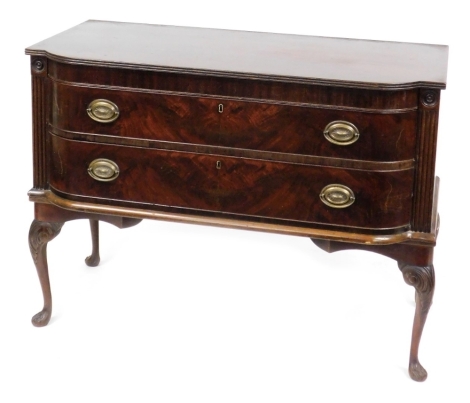 A late Georgian mahogany bow front chest, of two long drawers, raised on carved cabriole legs, 89cm high, 122cm wide, 56cm deep.