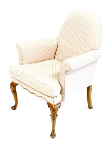 A Georgian style walnut framed armchair, upholstered in pink scale fabric, raised on shell capped cabriole legs, 71cm wide.