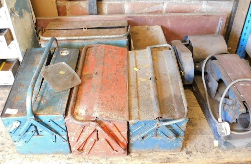 Four cantilever toolboxes containing tools, together with an electric belt sander. Buyer Note: WARNING! This lot contains untested or unsafe electrical items. It is supplied for scrap or reconditioning only. TRADE ONLY