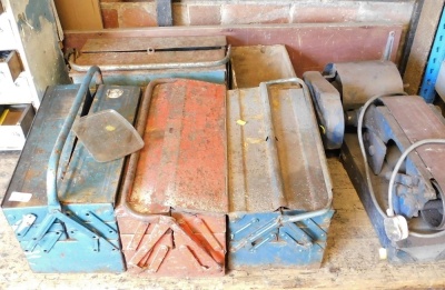 Four cantilever toolboxes containing tools, together with an electric belt sander. Buyer Note: WARNING! This lot contains untested or unsafe electrical items. It is supplied for scrap or reconditioning only. TRADE ONLY