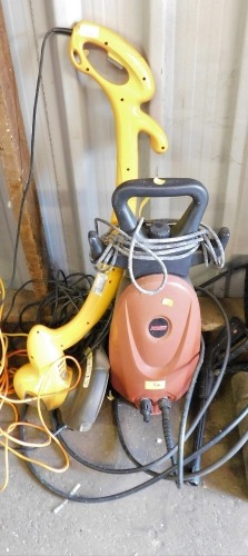 A Flymo electric power trim, together with a Power Base Xtreme power washer.