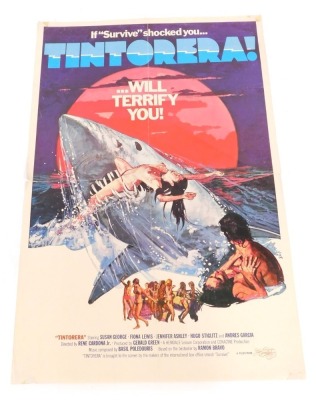 A 1980s film poster for Tintorera!, 102cm x 69cm. Mike Bell was a prolific artist of film posters throughout the 1970s, 80s, and 90s. His leading posters, as documented, include Robert Bolt's Lady Caroline Lamb, and Romancing The Stone. The collection ha