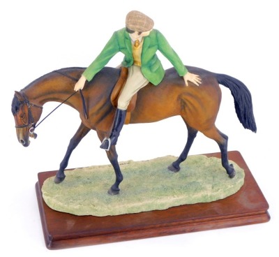 A Border Fine Arts Horse figure group, Gentleman Riding, in green jacket and peak hat, 29cm high, limited edition 291/750, signed D.Geenty's 1988.