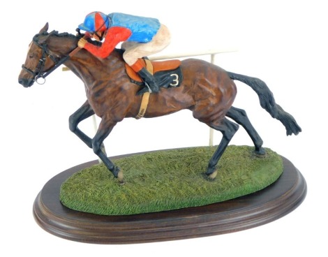 A Country Artists horse racing figure group, depicting Horse No 3 with rider, in blue and red, signed Gill Parker, 1989, 25cm high, 32cm wide.