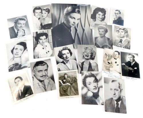 A collection of 1960s, 1970s, and 1980s black and white film star photographs, bearing printed signatures, to include Jean Simmons, Glynis Johns, Marilyn Monroe, Clark Gable, Gregory Peck, Kaye Kendall, Jane Hylton, Dickie Valentine, David Whitfield, Arth