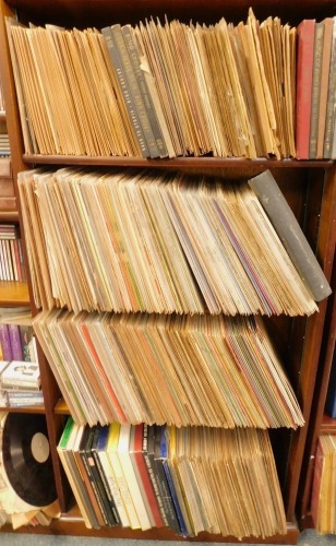 A large collection of Bing Crosby records, to include Crosby's Classics, compilation packs, The Chronological Bing Crosby Vol 6, 7, 8, 9, 10, 11, 12, and 13. (5 shelves)