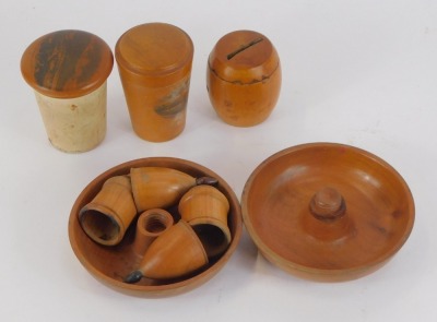 A group of mauchline ware boxes, comprising a The Pier Southsea Hants pin box, 7cm high, a treen string box, 5cm high, a needle case with Village of Kinloch Rannoch, plain body, 7cm high, and a two tier twist lid storage box, 10cm diameter. (4) - 2