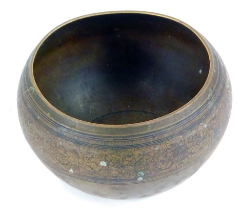 An early 20thC Eastern brass bowl, with a floral embossed rim, 7cm high, 9cm diameter.