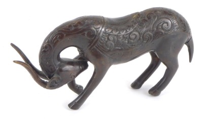 An Eastern hammered bronze figure of a standing antelope, 17cm wide.