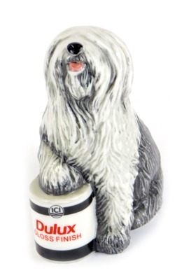 A Royal Doulton Dulux Dog miniature figure, Celebrating 50th Years of the Dulux Dog, dated 2011, stamped RDA144, 14cm high.